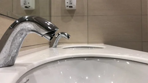 Washing hands with automatic sensor water tap. Energy saving concept. Stock Footage 105049320