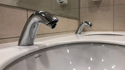 Washing hands with automatic sensor water tap. Energy saving concept. Stock Footage 105049332