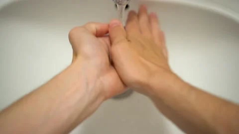 Washing hands in the bath Stock Footage