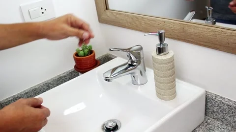 Washing hands in a bathroom Stock Footage 131251170