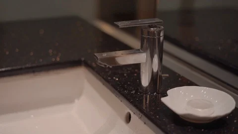 Washing hands in bathroom sink in slow-motion. Stock Footage 101062804