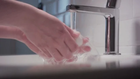 Washing hands in beautiful bathroom. Stock Footage 129335441