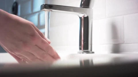 Washing hands in beautiful bathroom, saving water. Stock Footage 129335506