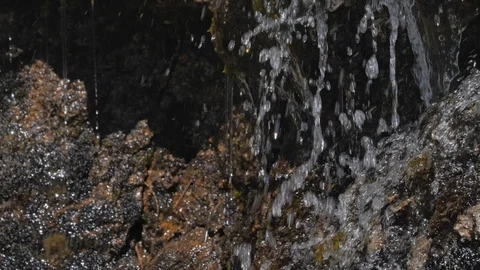 Washing hands in cold source water on mountain, Drinking Spring 動画素材 111614769