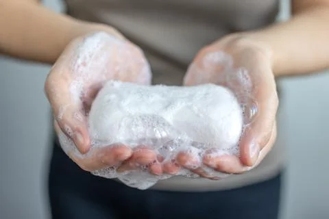 Washing hands with foamy white soap, protection against coronavirus. Close up Stock Photos