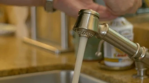 Washing hands in home kitchen Stock Footage 117541667