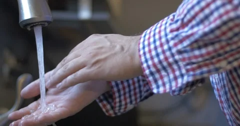 Washing Hands in Kitchen Sink Stock Footage 114703453