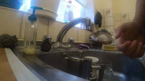 Washing Hands in Kitchen Sink Stock Footage 137823557