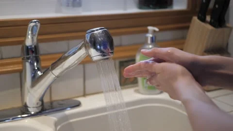 Washing hands kitchen soap bubbles coronavirus covid hygiene Stock Footage 155998801