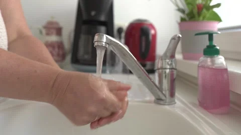 Washing hands with liquid soap Stock Footage 249728222