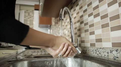 Washing hands in modern kitchen Stock Footage 46258014