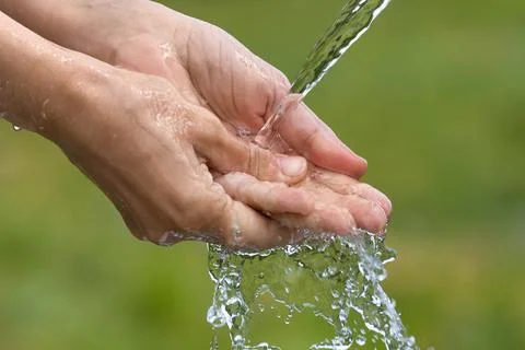 Washing of hands on nature background Stock Photos