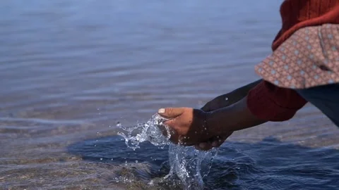 Washing hands in river (Slowmotion) Stock Footage 298400365