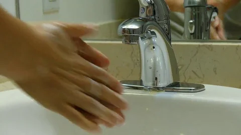 Washing hands rusty water Stock Footage 69107880