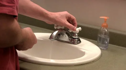 Washing hands in sink Stock Footage 10687505