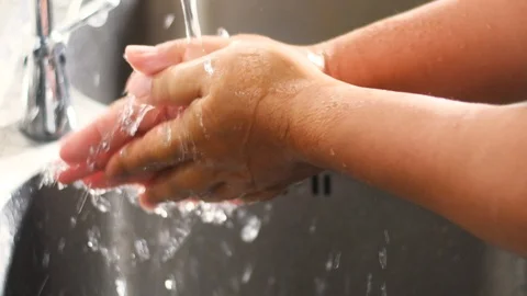 Washing hands by soap and wipe the hand with a cloth Stock Footage 125709208