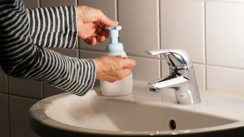 Washing hands with soap in the bathroom Stock Footage 114495933