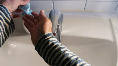 Washing hands with soap in the bathroom Stock Footage 114496897