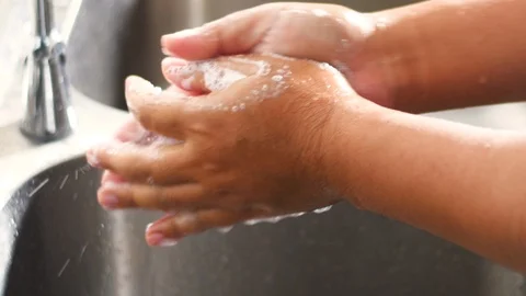 Washing hands by soap to prevent germs Stock Footage 125709139