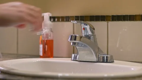 Washing hands with soap in sink to avoid corona virus infection Stock Footage 126260895