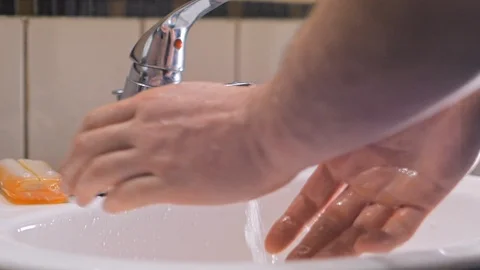 Washing hands with soap in sink to avoid corona virus infection Stock Footage 126263611