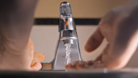 Washing hands with soap in sink to avoid corona virus infection Stock Footage 126264314