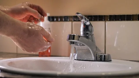 Washing hands with soap in sink to avoid corona virus infection Stock Footage 126264319