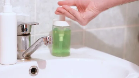 Washing hands with soap under the faucet with water. Hygiene concept. Stock Footage 127444264