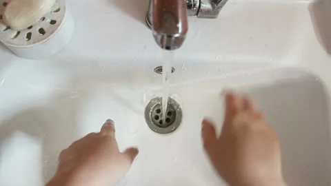 Washing of hands with soap under running water.Female hands under a stream of Stock Footage 91269374