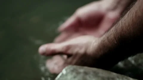 Washing hands in the stream Stock Footage 22921811