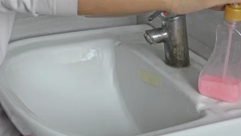 Washing hands under the running streams of water from tap Stock Footage 126270713