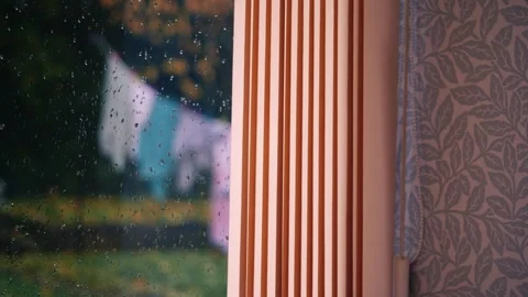 Washing hung out on line in rainfall Stock Footage 255312898