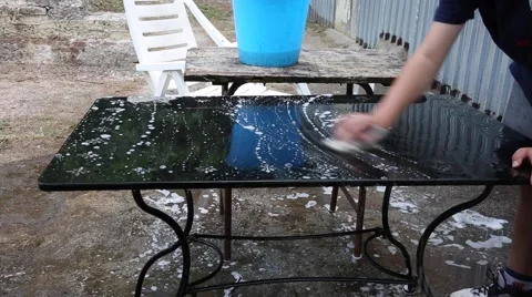 Washing an iron table Stock Footage 50858146