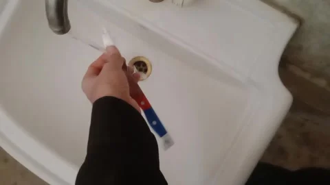 Washing a Kitchen Knife Under Running Water in Daylight Stock-Footage 347182671