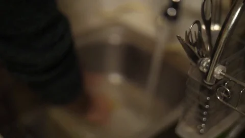 Washing up kitchen pyrex slow motion Stock Footage 90291574