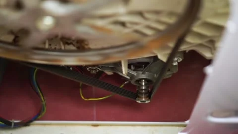 Washing laundry machine drum rust bearing malfunction repair internals view belt Video stock 153945596