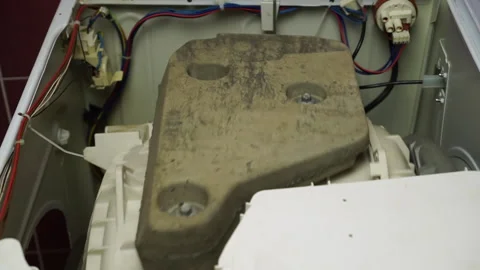 Washing laundry machine drum vibration malfunction repair internals service Video stock 130473903