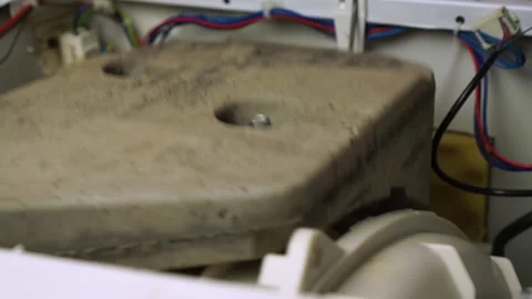 Washing laundry machine excessive drum vibration counterweight rubber seal view Video stock 130473944