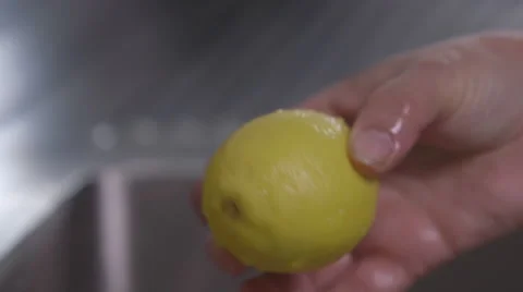 Washing a lemon Stock Footage 64056014