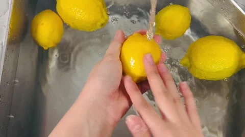 Washing Lemons Close-up Shot, Hand Cleaning Fresh Citrus Fruit in Kitchen Sink Stock Footage 337785190