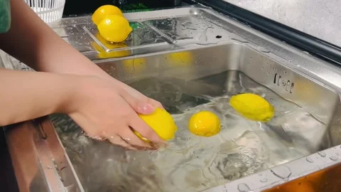 Washing Lemons in Sink, Hand Cleaning Fresh Citrus Fruit Stock Footage 337785200