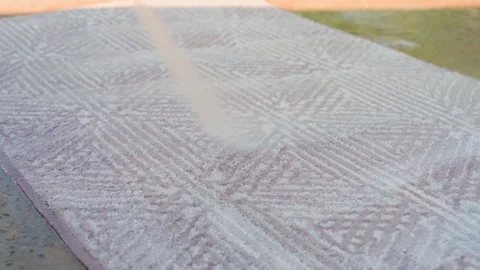 Washing a light-colored carpet with a high-pressure washer, slow motion Stock-Footage 314766255
