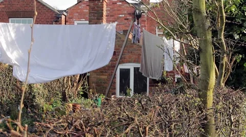 Washing Line - Socks, Sheets, Clothes &amp; Towels Hanging in Victorian House Garden Stock-Footage 49074680