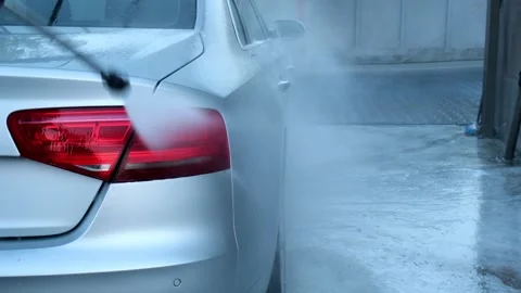 Washing luxury silver car on touchless car wash. Washing sedan car with foam Stock Footage 261494647