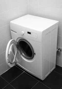 Washing machine in the bathroom Foto stock