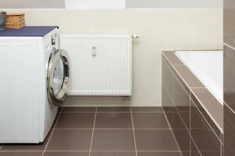 Washing machine in bathroom Stock Photos