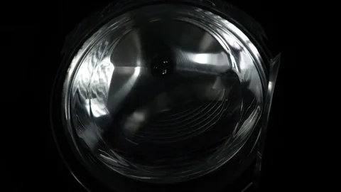 The washing machine on a black, dark background. Spinning drum. The washing p Video stock 121529907