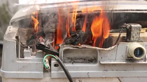Washing machine burning due to electrical short circuit. Stock Footage 296781703