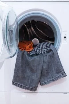 Washing machine with clothes Stock Photos