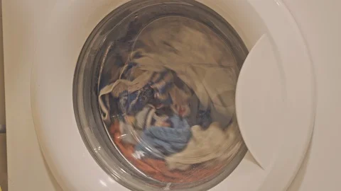 Washing machine with color clothes Video stock 106618880